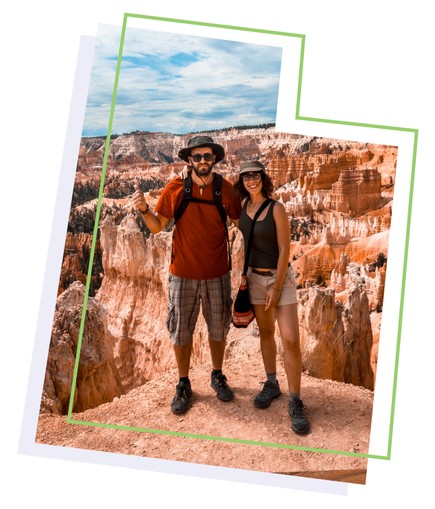 Two hikers standing in a canyon